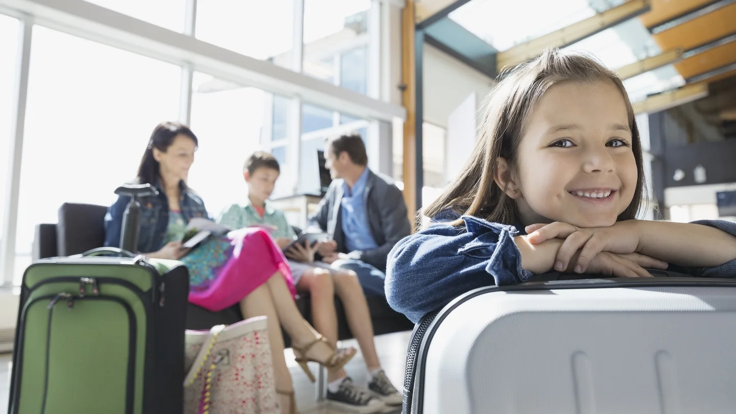 Smiling girl waiting in airport