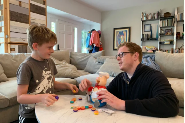 Clinician playing toys with a child