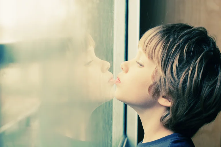Child next to window