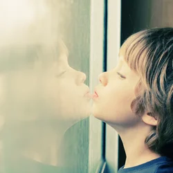 Child next to window