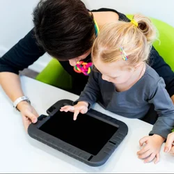 An adult and a child working together on a tablet
